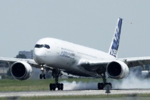 Airbus workers cheer maiden flight of their new A350 aircraft