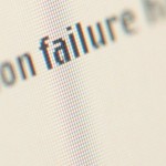 1001107999close-up-of-a-failure-warning-on-a-pixelated-computer-screen-posters